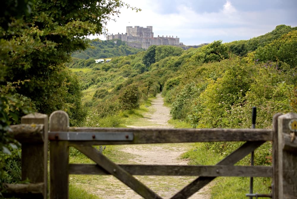 A countryside footpath near Dover with a castle on the horizon
