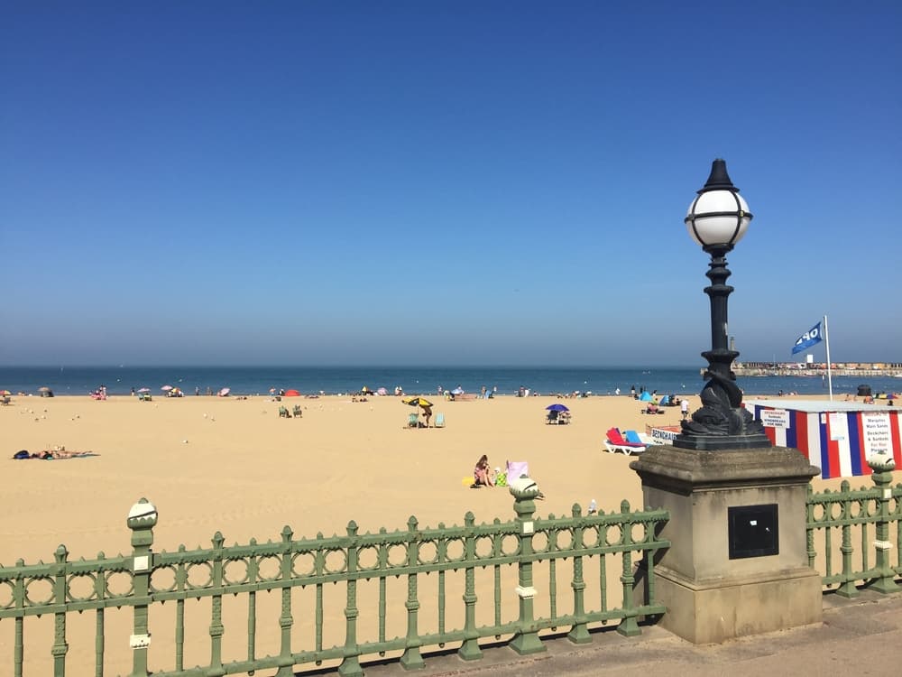 A sandy Thanet beach seen from the seafront promenade